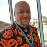 This is a selfie photo of Brad Williams, CEO. He is wearing his famous Halloween pumpkin suit.