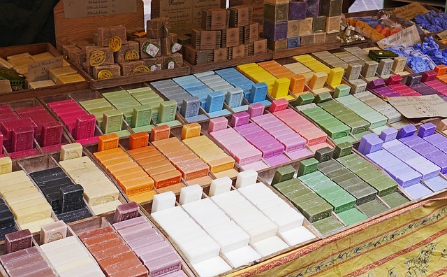 A photograph of a variety of soap bars at a flower market.