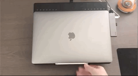 A GIF animation of the external mounts used on a monitor and MacBook that show how enhancing your work space can be beneficial.