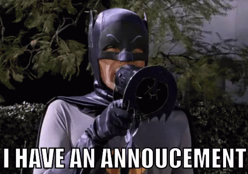 This is a GIF of the 1960s TV Batman saying through a bullhorn, "I have an announcement."