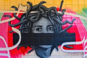 Photo image of a graffiti style painted mural of Medusa.