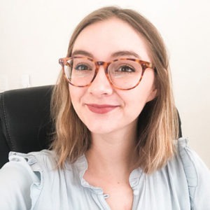 This is a selfie photograph of Autry Reeves, Assistant Project Manager at WebDevStudios and Maintainn. She is wearing glasses and smiling at the camera.
