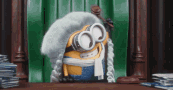 This is a GIF of a Despicable Me minion character wearing a judge's wig and hammering down a gavel.