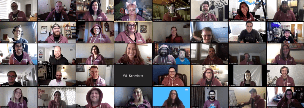 A stitched image of the various Zoom video screens from each WebDevStudios employee who attended WDS Virtual Camp. The employees are wearing their new WDS hoodies and smiling at the camera.
