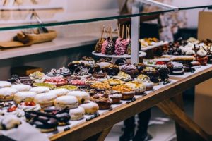 This is a photo of a table filled with donuts and pastries.