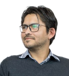 This is a portrait of WebDevStudios Backend Engineer, Mauricio Andrade. He is wearing glasses and looking away from the camera.