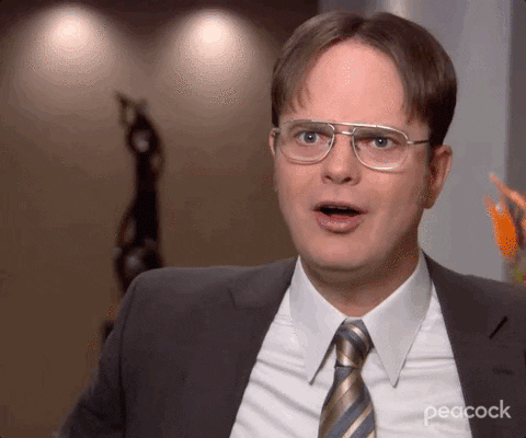 This is a GIF image of Dwight from "The Office" exclaiming, "Wow!"