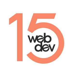 This is a WebDevStudios 15-year anniversary commemorative logo. It features the number 15 in orange and the WebDev logo in dark grey.