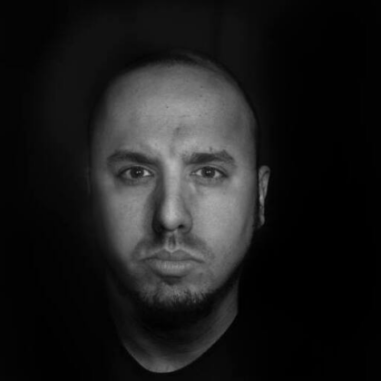 This is a black and white portrait photo of Rami Abraham, Lead Engineer at WebDevStudios.