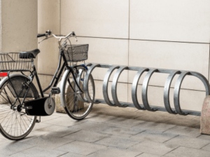 This is a photo of a single bike on a bike rack built for four bicycles used to convey WordPress hosting.