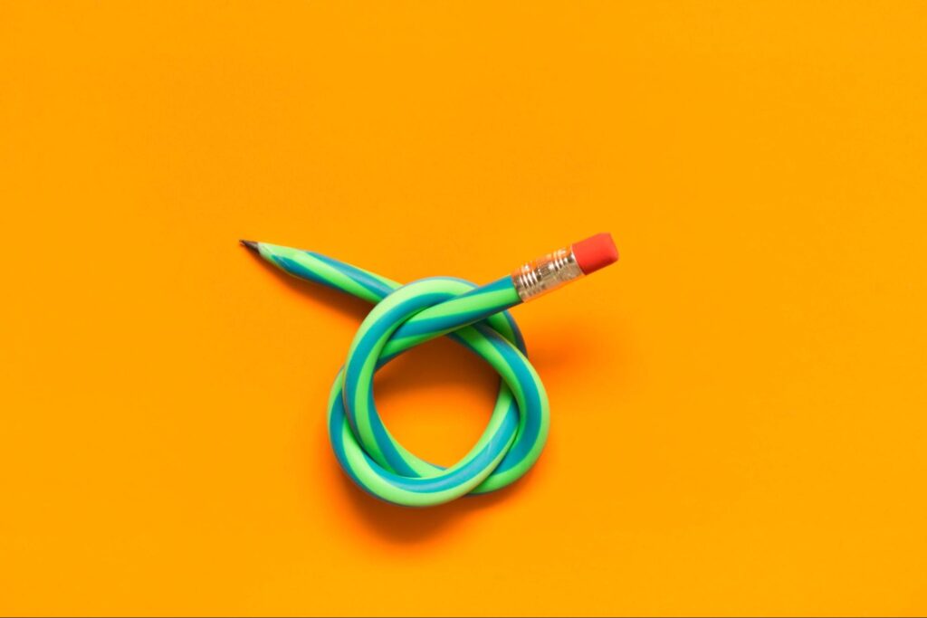 This is an image of a green pencil in a knot.