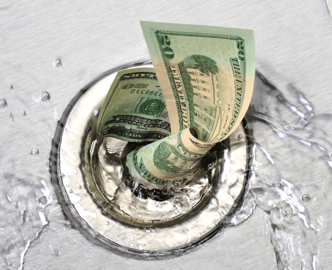 This is a photo of money going down the sink drain to indicate how costly using a Custom CMS for a website solution is.